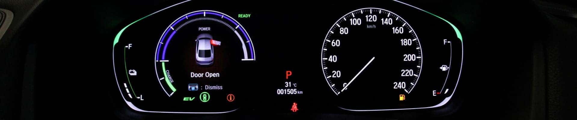 Digital vehicle instrument cluster displaying speed, fuel level, battery charge, mileage, and a door-open warning.