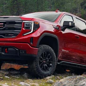 2022 GMC 1500 exterior driving over rocky terrain