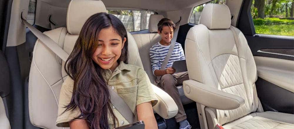 2022 Buick Enclave showing two children happily seated in back seats