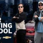Chevy All Star Driving School Mexico 2022 experts standing with arms crossed leaning against a Chevrolet.