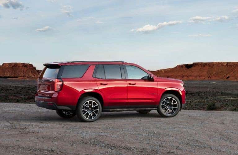 Red 2023 Chevy Tahoe RST Rear Exterior on a Desert Road