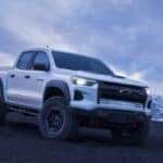 white colorado zr2 bison going over hill