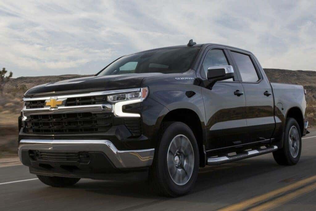 Chevrolet Silverado Driving Through a Desert Front 3/4 View