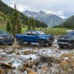 Exterior shot of the 2023 Chevrolet Silverado 1500 High Country (left), ZR2 (middle) and LT (right).