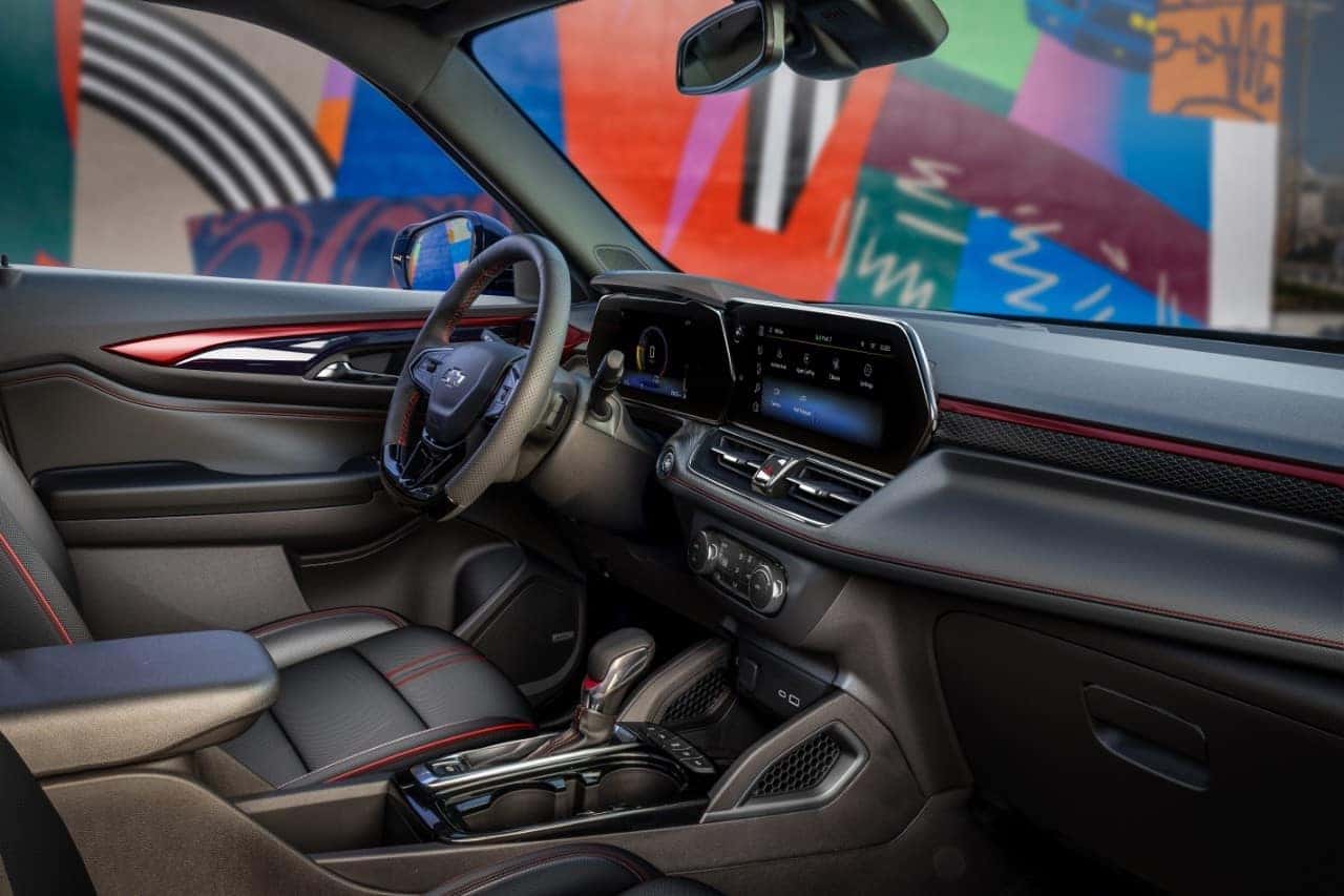 View of front cabin from passenger’s side of the 2024 Chevrolet Trailblazer RS with Jet Black with Red Accents interior. Preproduction model shown. Actual production model may vary. Available in fall 2023.