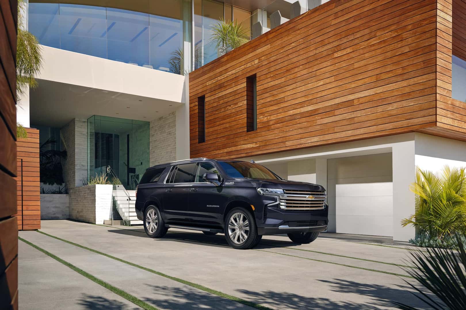 The new Suburban High Country front three-quarter view parked.