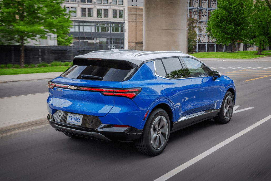 Riptide Blue Metallic 2024 Chevrolet Equinox EV LT driving on road