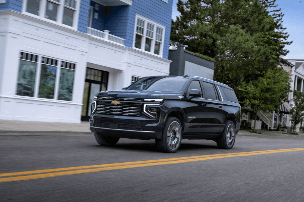Chevrolet Suburban Driving in a City Front 3/4 View