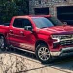 A red 2023 Chevy Silverado 1500 Z71 is shown parked on a driveway after visiting a Chevy dealer in Shreveport.