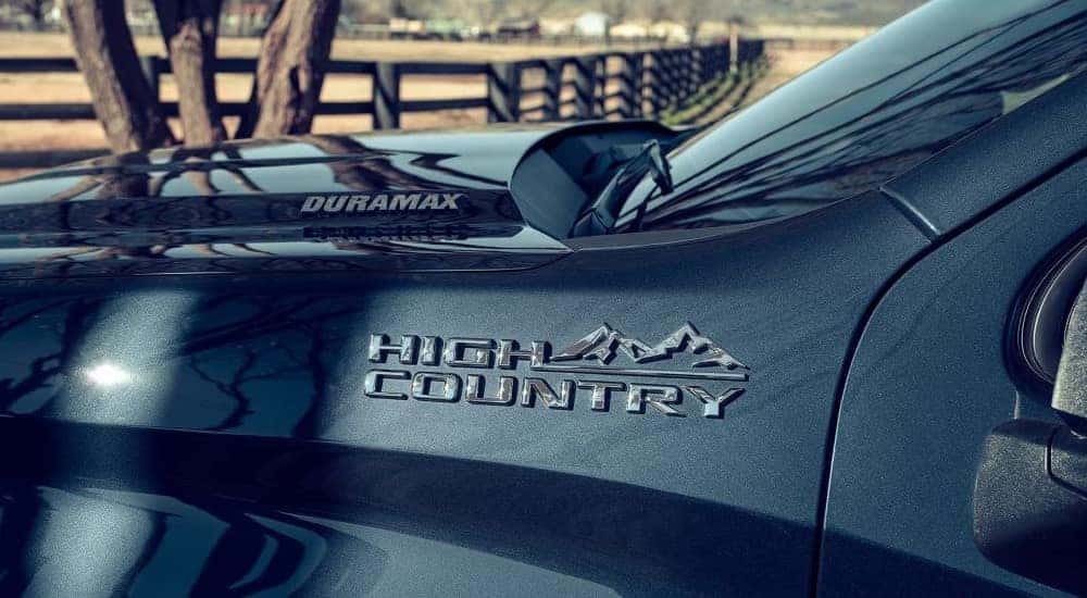 The High Country badge is show on a dark blue 2023 Chevy Silverado 1500 High Country.