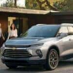 A silver 2024 Chevy Blazer for sale is shown parked on a driveway.