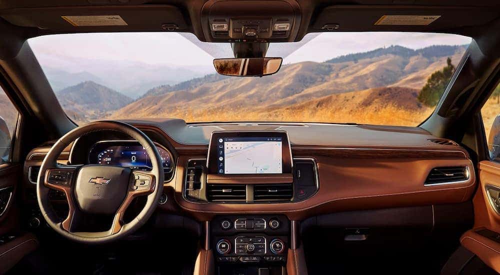 The brown leather front seats and dashboard in a 2024 Chevy Tahoe High Country.