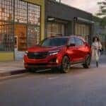 A red 2024 Chevy Equinox RS is shown parked after visiting a Chevy dealer near Benton.