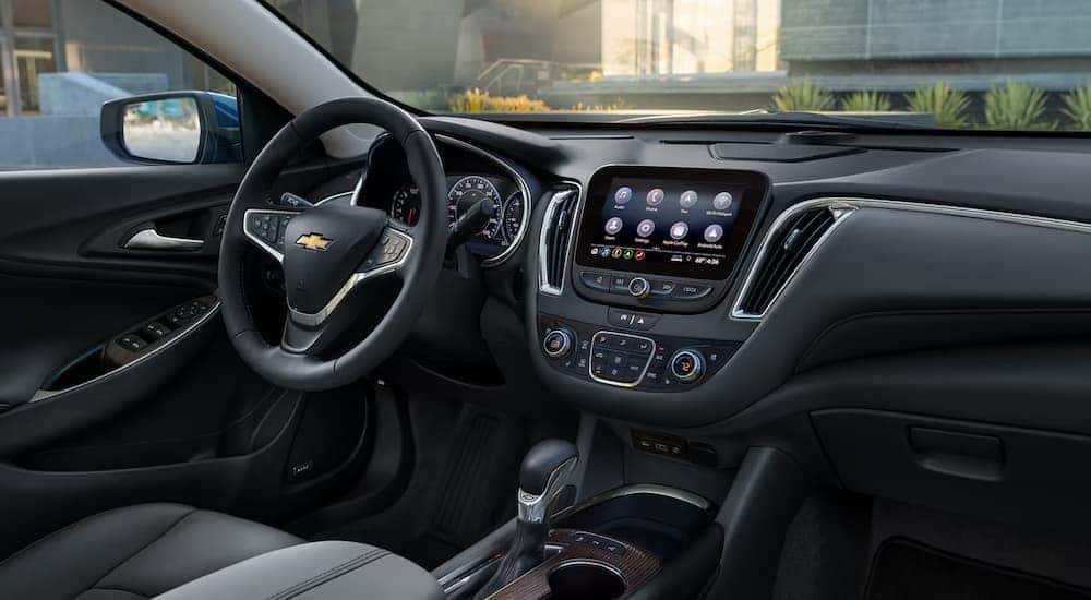 The black interior and center console of a 2024 Chevy Malibu.