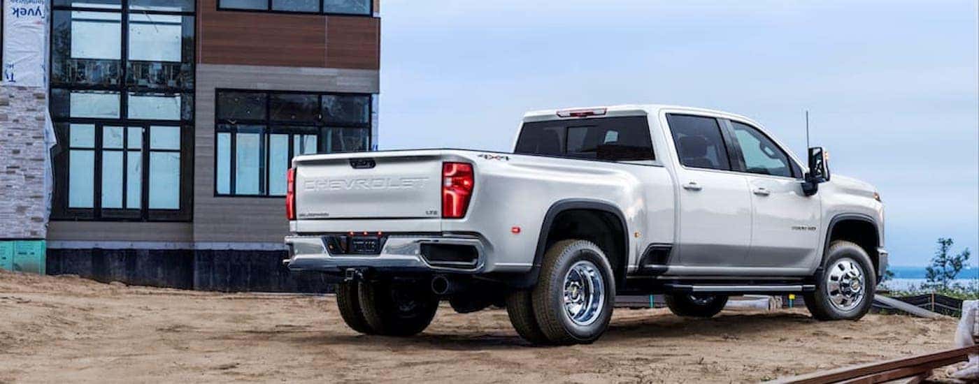 A white 2024 Chevy Silverado 3500 HD LTZ is shown from the rear at an angle.