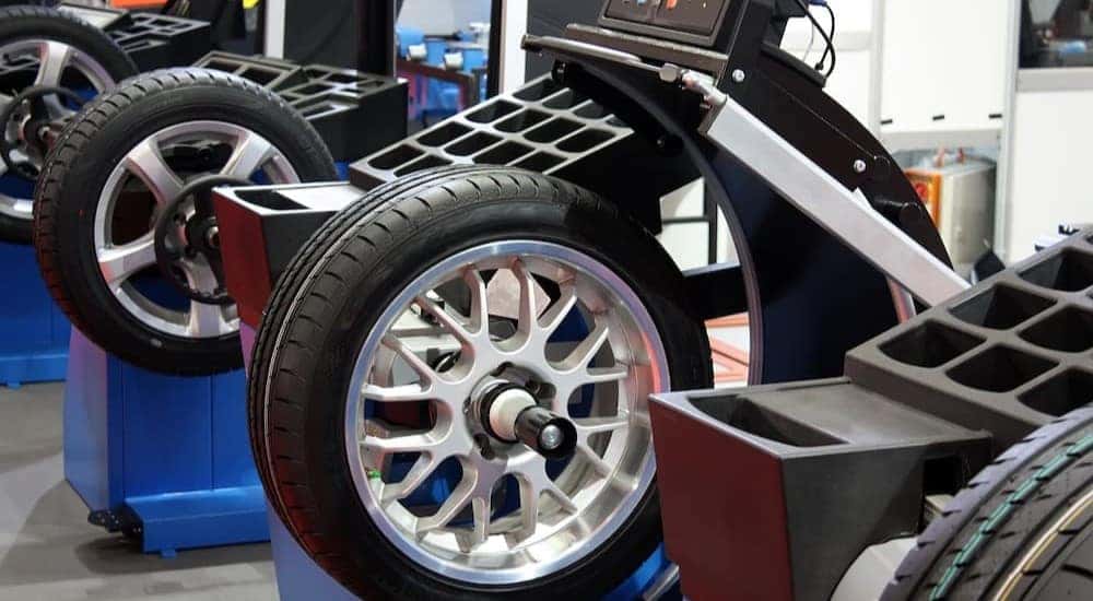 Tires are shown being balanced.