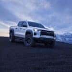 A white 2024 Chevy Colorado ZR2 Bison is shown parked off-road.