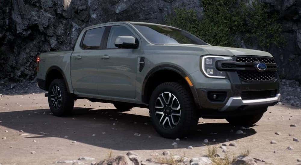 A gray 2024 Ford Ranger is shown parked off-road.