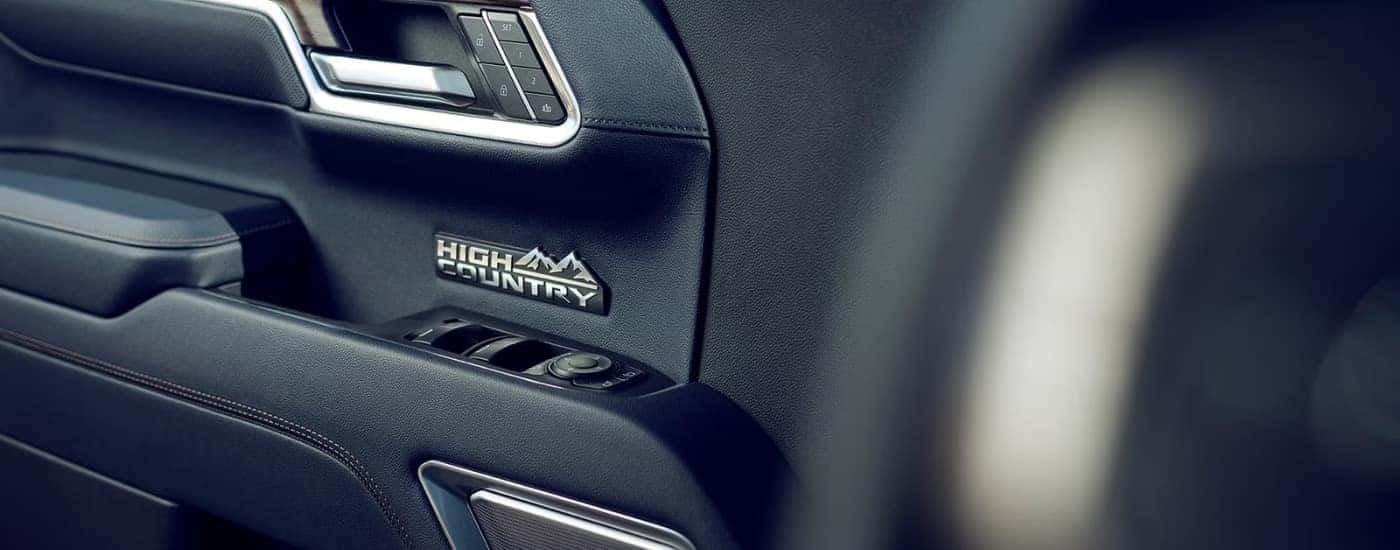 The 'High Country' badge is show on the door card of a 2023 Chevy Silverado 1500 High Country.