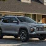 A gray 2025 Chevy Equinox LT is shown parked on a driveway.