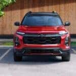 A red 2025 Chevy Equinox RS parked at a Chevy dealer near Waskom.