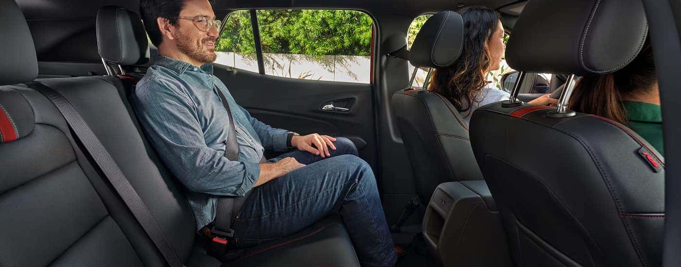 Man sitting in the back seat of a 2025 Chev Trax