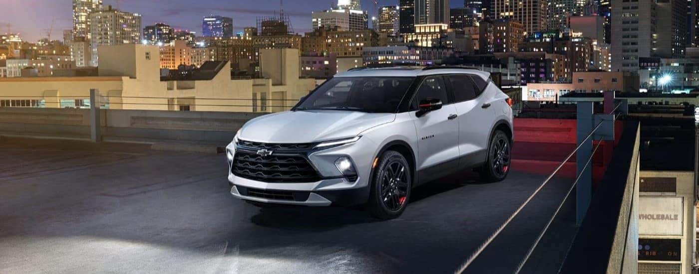 A white 2024 Chevy Blazer is shown parked at a Chevy dealer near Benton.