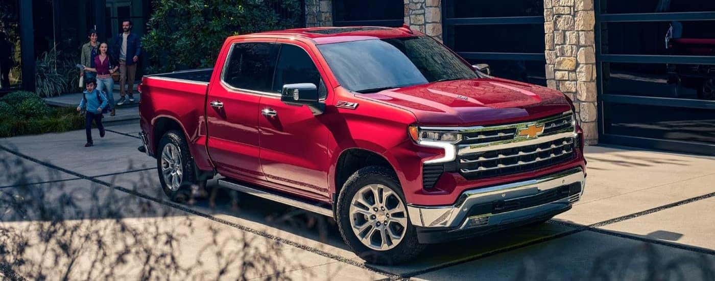 A red 2023 Chevy Silverado 1500 Z71 for sale parked on a driveway.
