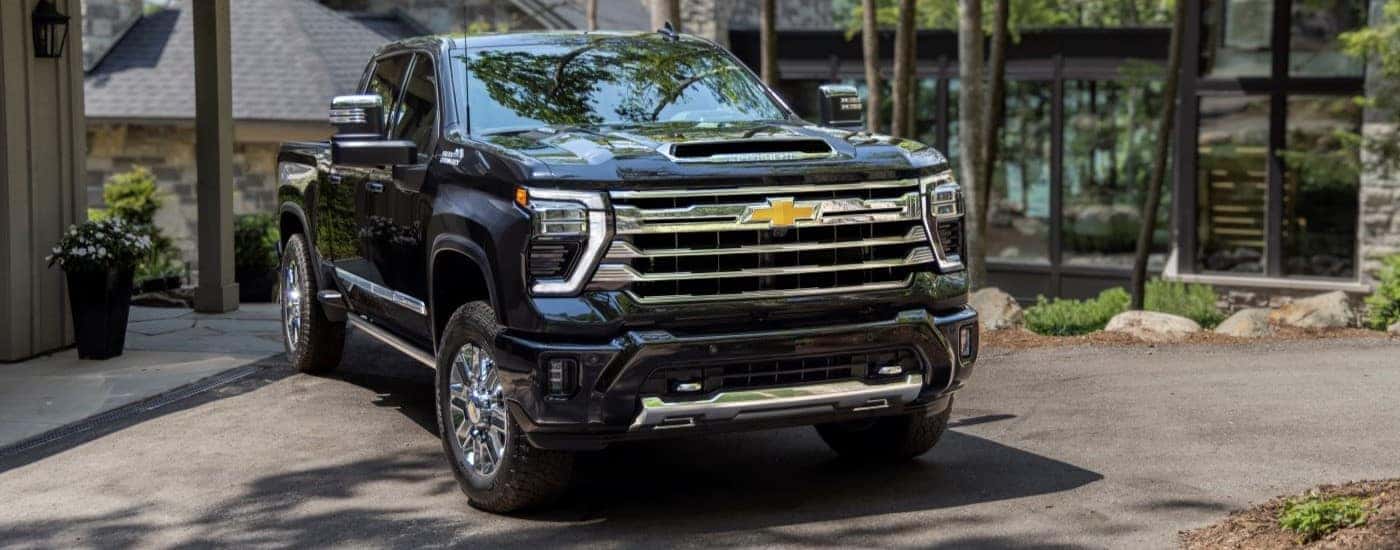 A black 2024 Chevy Silverado 3500HD is shown parked after viewing a Chevy Silverado for sale near Bossier City.