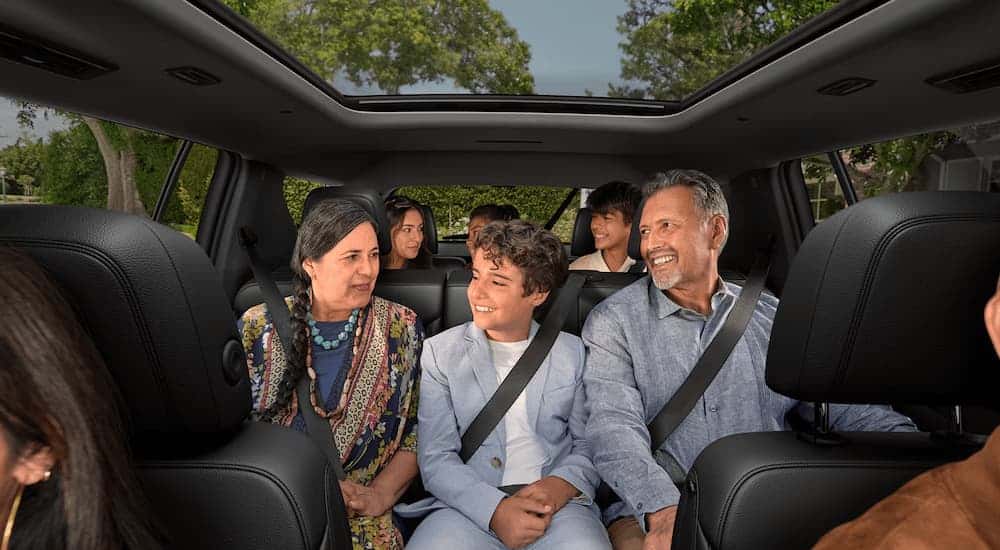 Family sitting in the rear rows of a 2026 Chevy Traverse