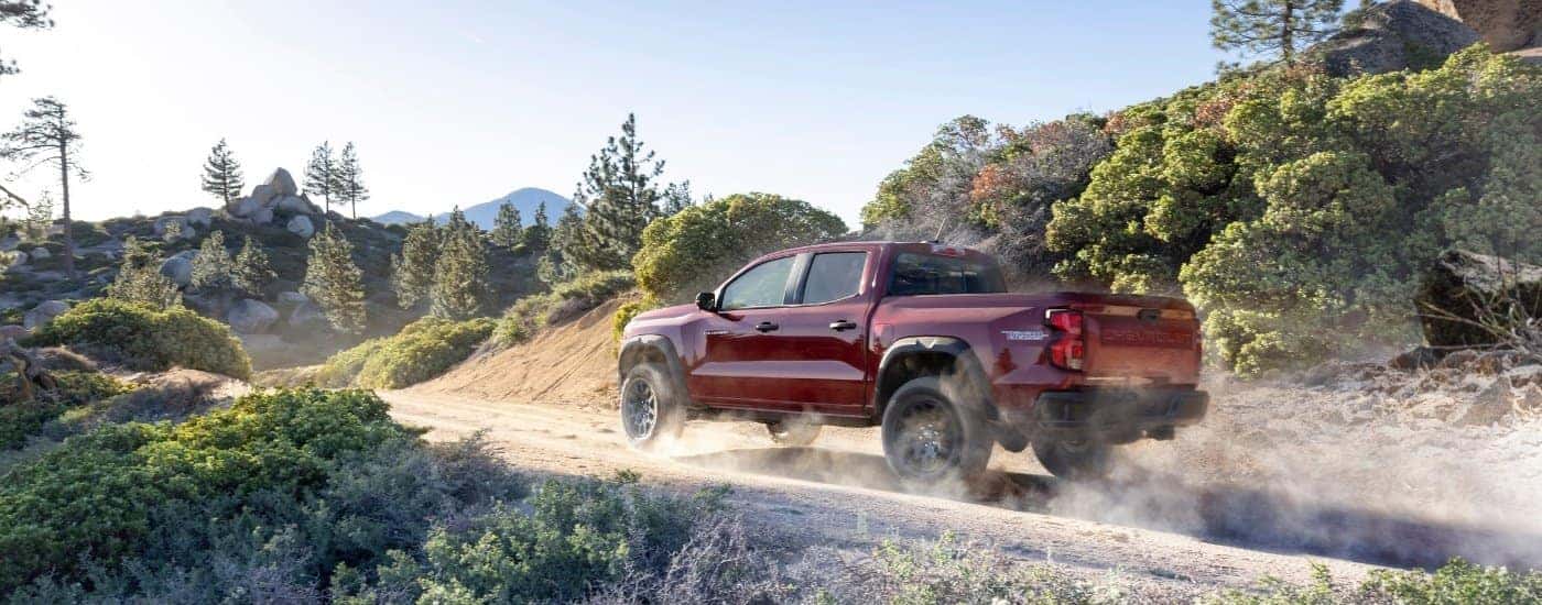 A red 2025 Chevy Colorado from the side.