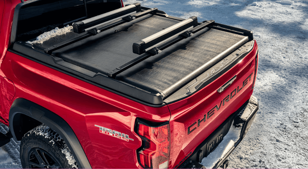 Red 2026 Chevy Colorado Trail Boss with a ski rack on the bed
