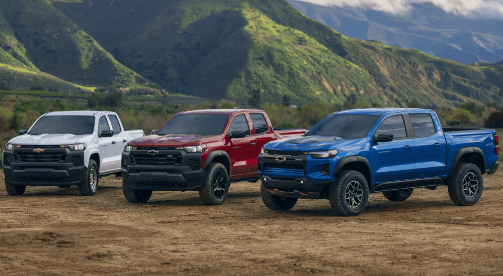 Three Chevy Colorados parked off-road