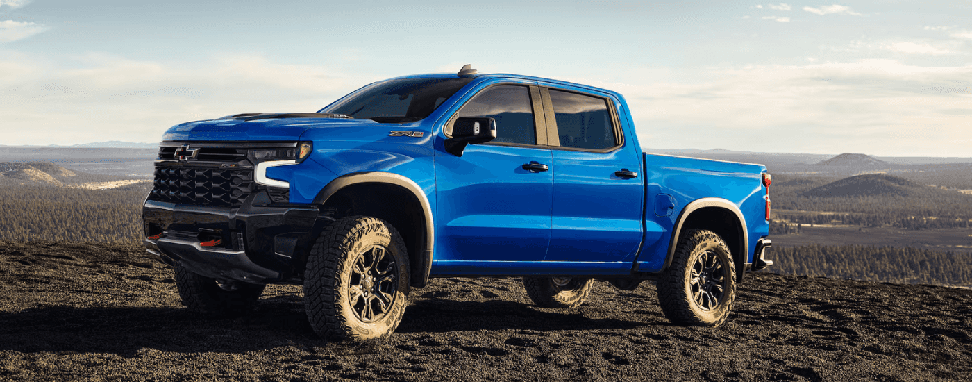 Blue 2025 Chevy Silverado 1500 ZR2 parked off-road