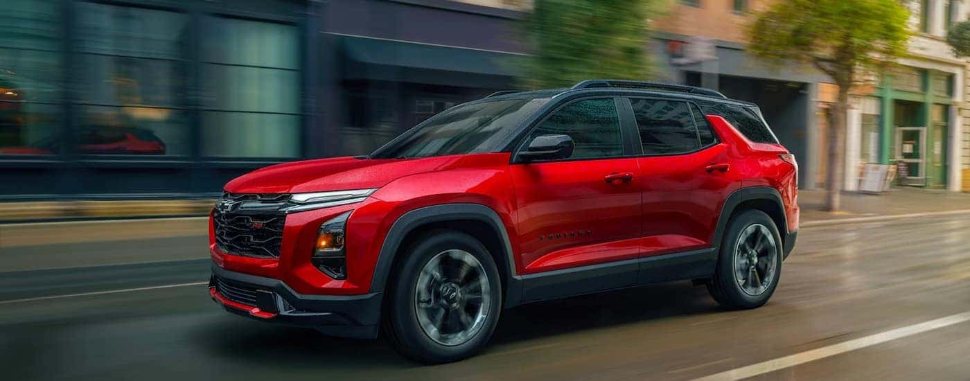 A red 2026 Chevy Equinox RS driving for sale near Ruston