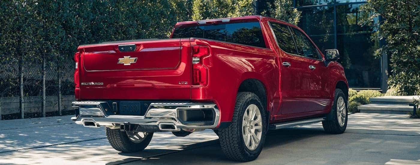 Red 2023 Chevy Silverado 1500 LTZ parked in a driveway