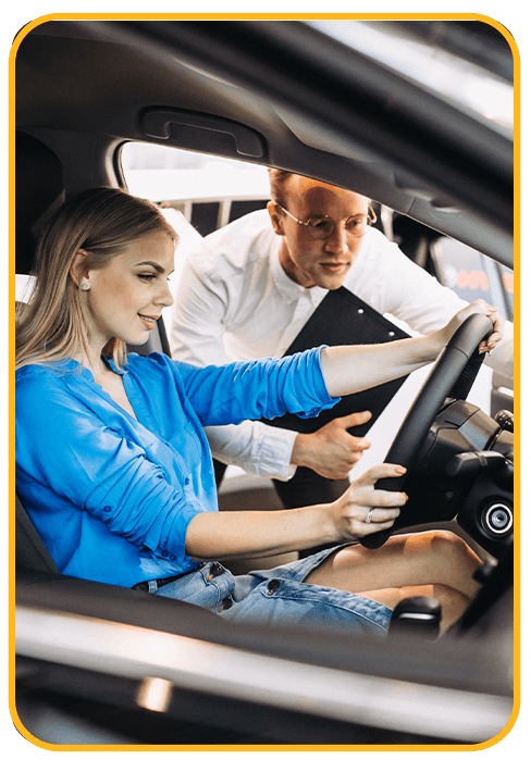 Things to Check When Buying a Used Car | CMA Chevrolet of Martinsburg in Martinsburg, WV | Woman in blue shirt is about to test drive a used car while sales person beside her is showing the car features