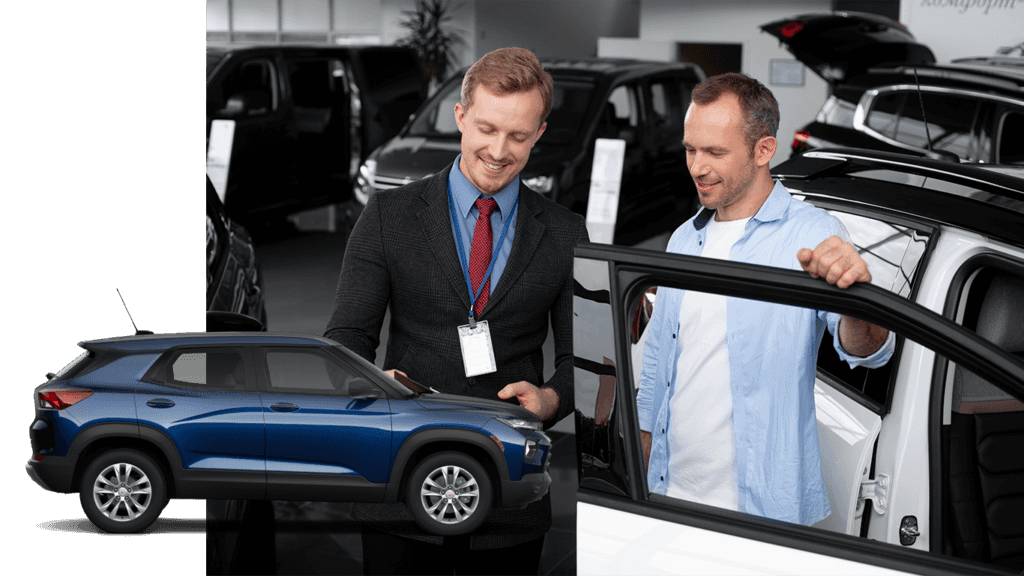 Best Time To Buy At CMA Chevrolet of Martinsburg in Martinsburg, WV | Side view of a Blue 2022 Chevrolet TrailBlazer with a background photo of a sales person talking to a man about about car prices 