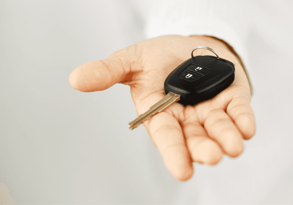 High Cost of Replacing a Car Key | CMA Chevrolet of Martinsburg | Person holding car key fob