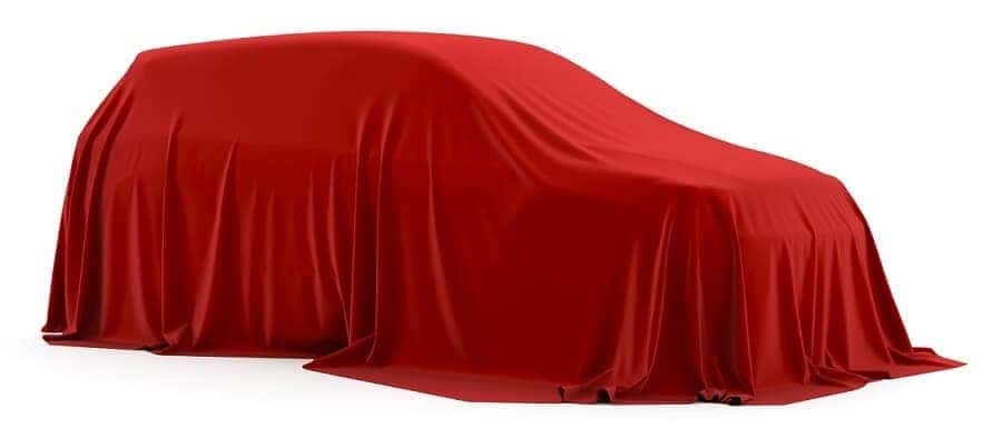 2022 Dodge Charger under red cloth