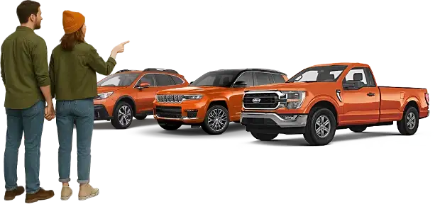 Couple looking at used vehicle inventory