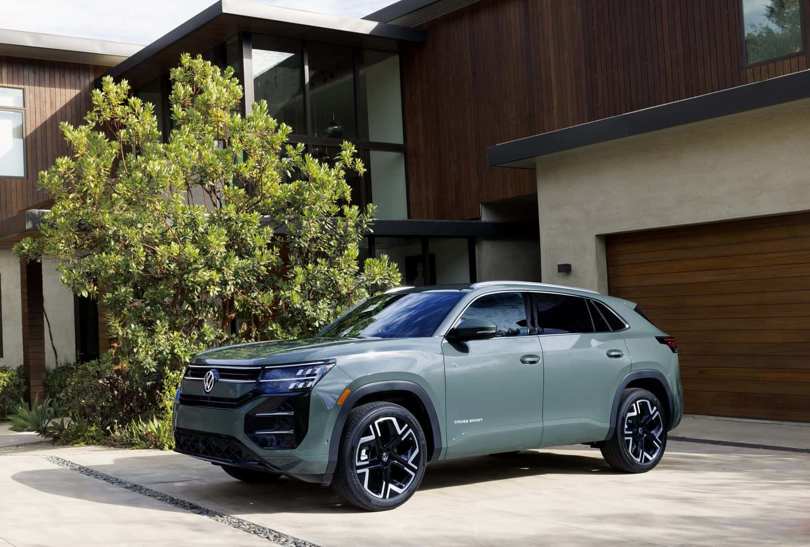 2027 Volkswagen Atlas Cross Sport in Dark Sage Metallic, front three-quarter view, available at Emich Volkswagen of Boulder