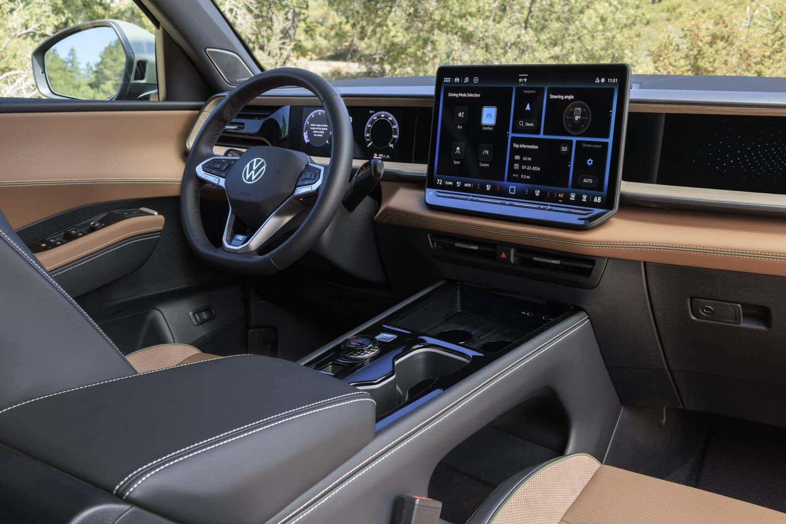 Interior of the 2027 Volkswagen Atlas Cross Sport showing the 15-inch touchscreen, Digital Cockpit Pro, and Driver Experience Dial