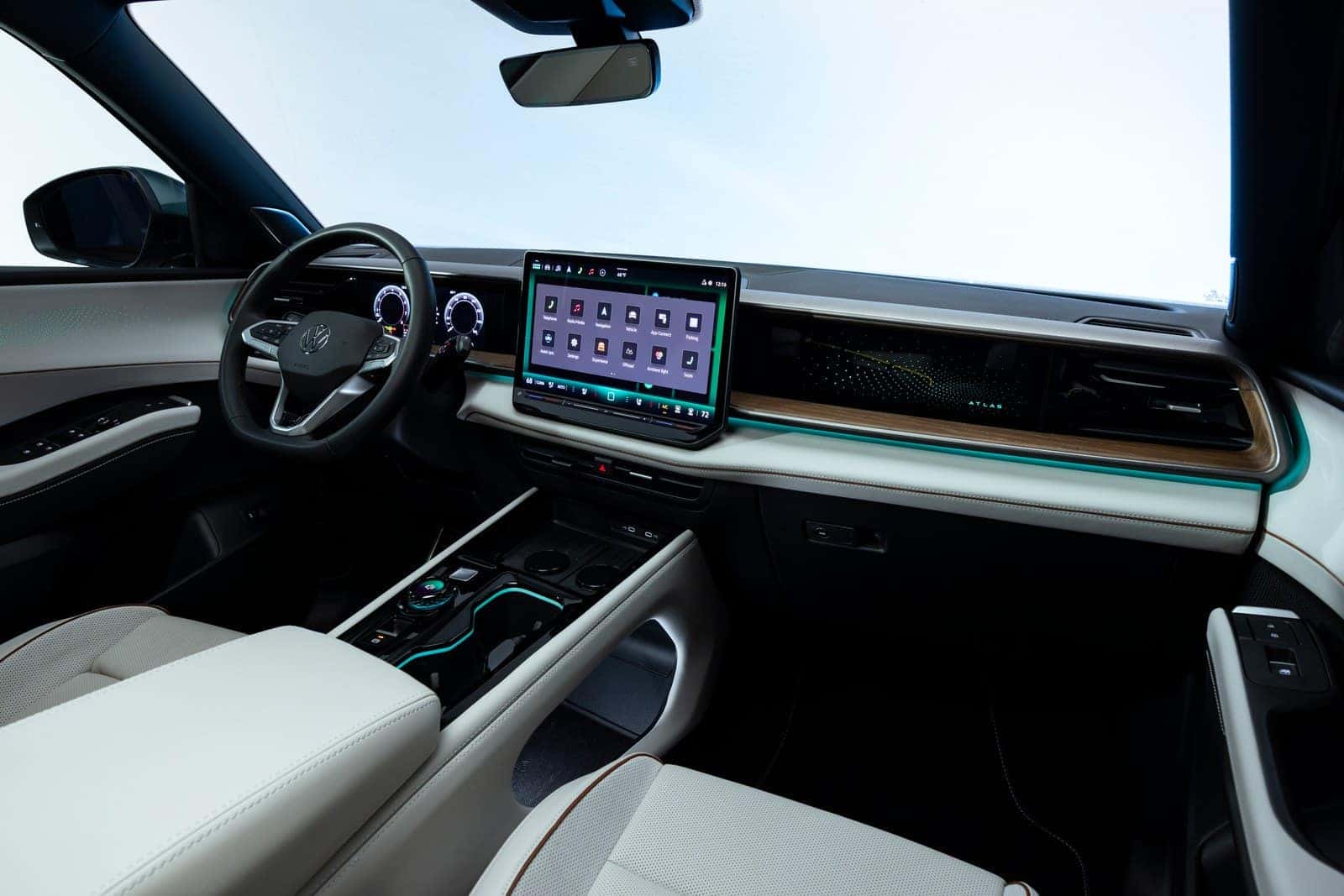 2027 Volkswagen Atlas interior with 15-inch infotainment display, real wood decor and ambient lighting