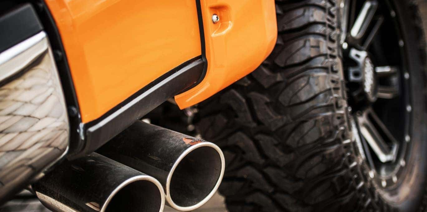 Closeup of wheel and exhaust of lifted truck