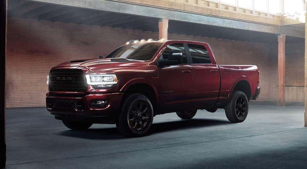 A red 2024 Ram 2500 parked in a parking garage after visiting a Ram dealer near Shelby.