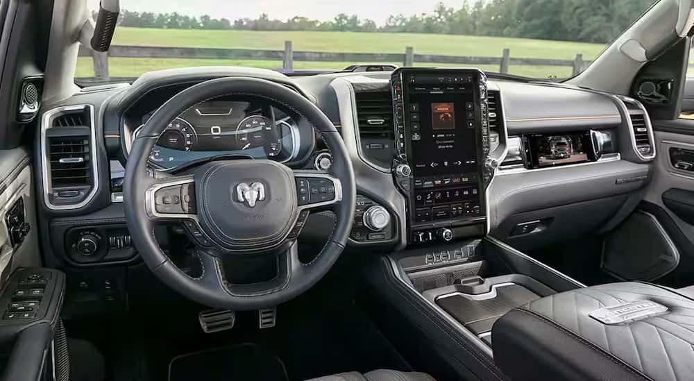 The gray interior and dash are shown in a 2025 Ram 1500.