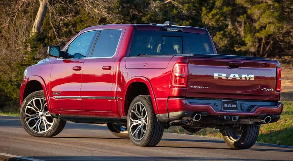 A red 2025 Ram 1500 Tungsten is shown parked from the rear.
