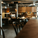 Brown wooden restaurant table with chairs