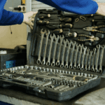 A Person Holding a Set of Tools in a Toolbox